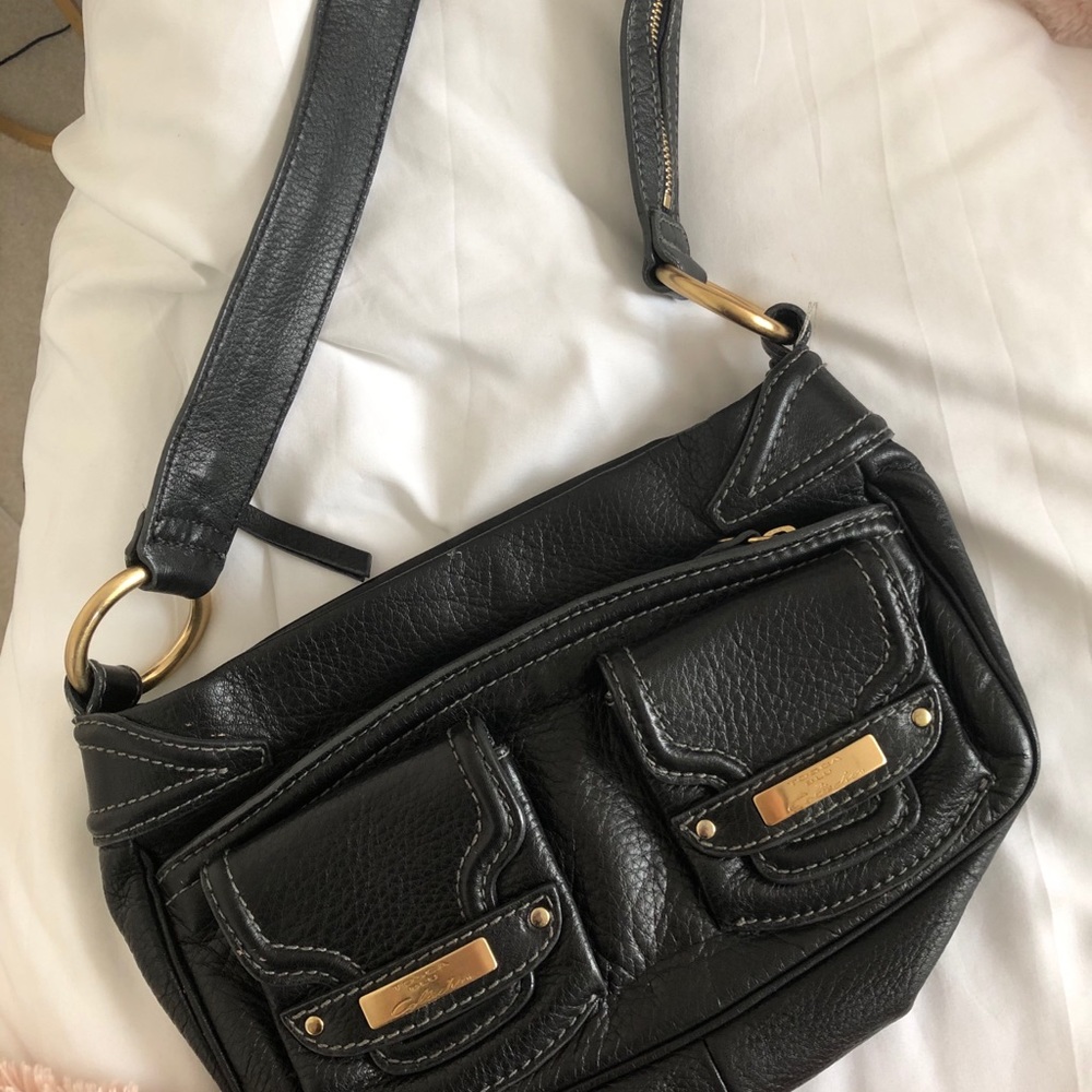 Cute little shoulder bag, it is from the 2000’s